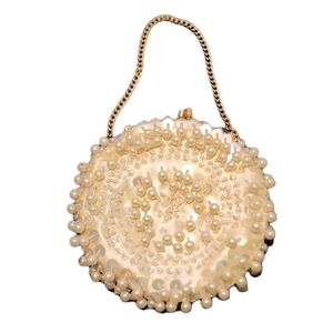 La Regale Pearl-Embellished Gold Wristlet
